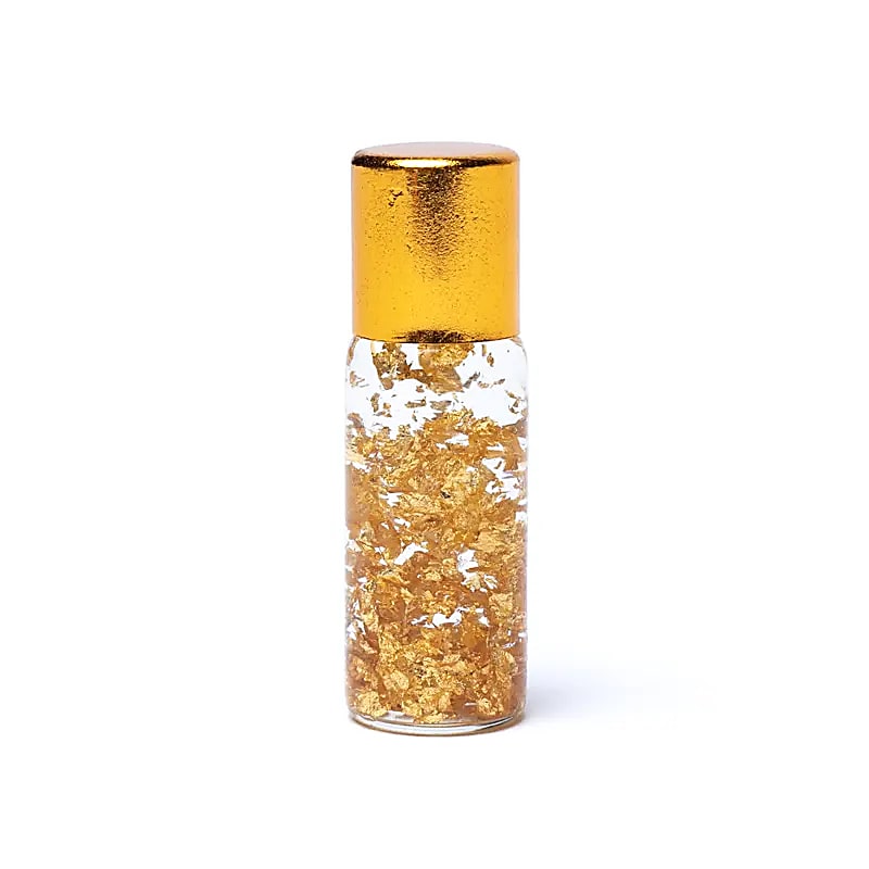 Frasco esotérico con láminas de oro puro 23 K en vial de amuleto místico para protección espiritual.