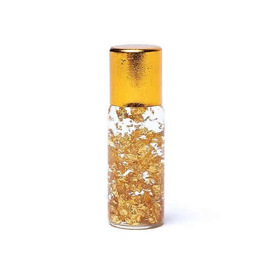 Frasco esotérico con láminas de oro puro 23 K en vial de amuleto místico para protección espiritual.