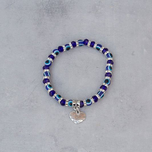 Pulsera de cuentas azul Ojo Turco con amuleto de corazón en acero — protección, energía positiva y amor en accesorio esotérico de alta calidad.