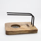 Soporte quemador de madera natural para Palo Santo con varillas negras.