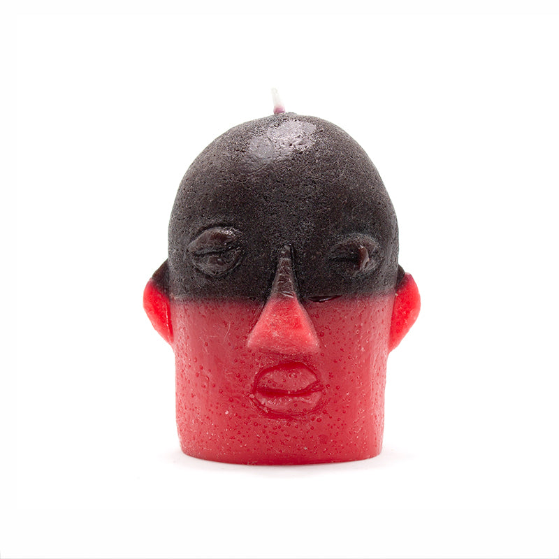 Velón Elegua rojo y negro con rostro para rituales de protección y apertura de caminos