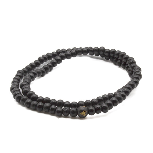 Mala de 111 cuentas de madera de ébano para meditación, protección espiritual y enfoque en mantras.
